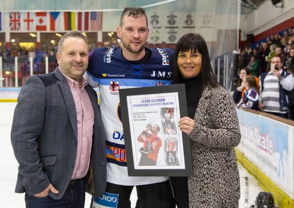 Jason Buckman with club owners David and Jo Lane after announcing his retirement last season.
