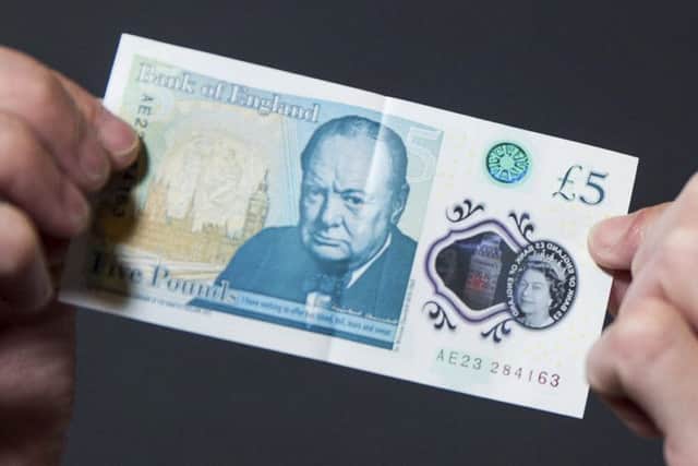 Brits are being urged to check their new fivers after engraved bank notes worth as much as Â£50,000 were circulated in a Willie Wonka-style 'Golden Ticket' giveaway.
