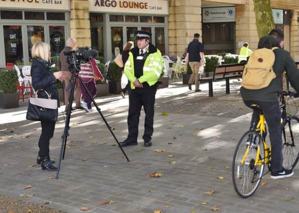 A cyclist going down Bridge Street during interviews for the relaunch of the Prevention and Enforcement Service