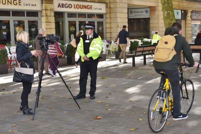 A cyclist going down Bridge Street during interviews for the relaunch of the Prevention and Enforcement Service
