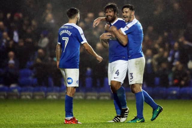 Michael Bostwick of Posh is congratulated after scoring his first goal of the season in a 5-2 win over Chesterfield. Photo: Joe Dent/theposh.com.