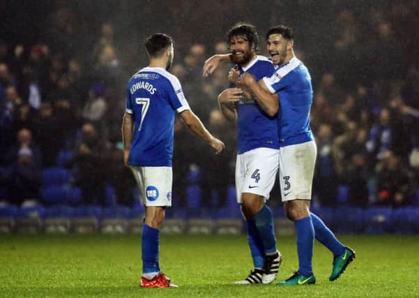 Michael Bostwick of Posh is congratulated after scoring his first goal of the season in a 5-2 win over Chesterfield. Photo: Joe Dent/theposh.com.