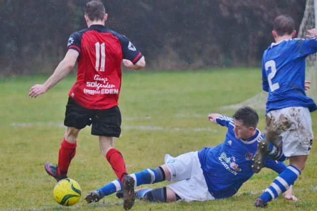 Action from ICA Sports v Netherton (red). Photo: David Lowndes.