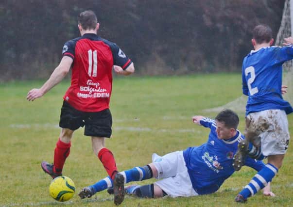 Action from ICA Sports v Netherton (red). Photo: David Lowndes.