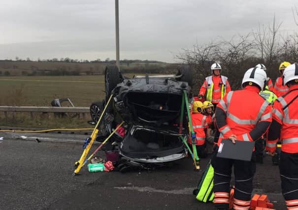 The scene on the A605 today where a car has overturned - Photo @roadpoliceBCH