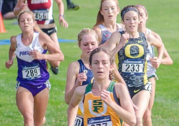 Charlotte Taylor running for her university team.