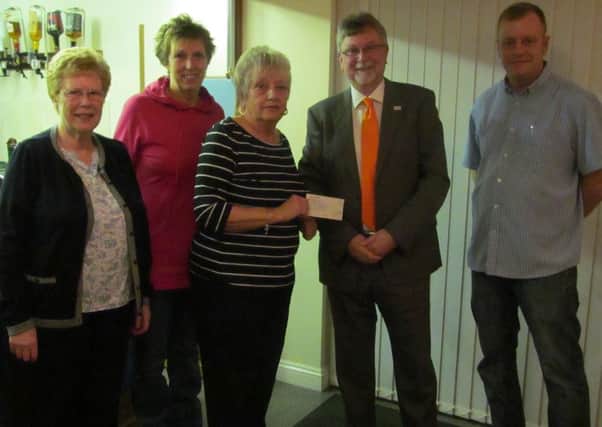 Steve Holt (second right), the Magpas director of fundraising, is pictured receiving a cheque for Â£760 from Peter Bavisters widow Margaret ,who was accompanied by (left to right) Peters sister Rita Mace, daughter Sue Welsford and son-in-law and club president Martin Welsford.