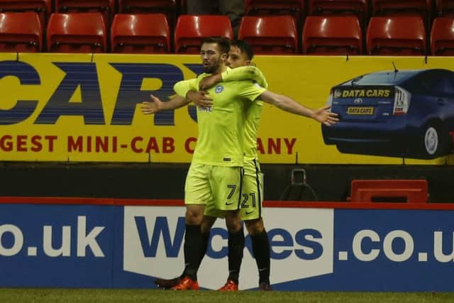 Gwion Edwards celebrates his goal for Posh at Charlton with Tom Nichols.