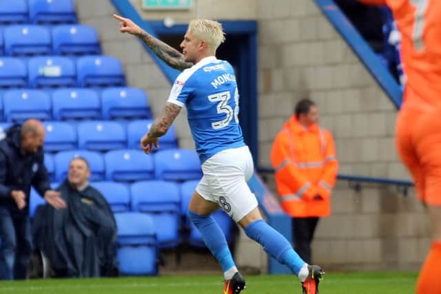 George Moncur celebrates a goal for Posh against Port Vale.