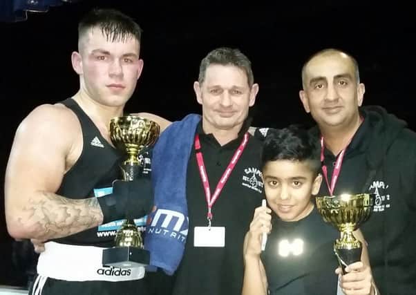 Kieran Cocker (left) and Imraan Shirazi  and coaches Paul Goode and Akif Shirazi with their trophies after winning in Basildon on Saturday night.