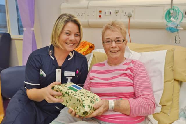City Hospital campaign to get present for everyone in hospital over Christmas.
Liz Foley with ward sister Katy Knowles EMN-161218-113928009