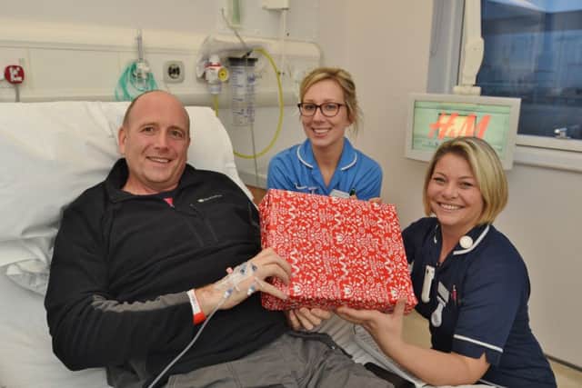 City Hospital campaign to get present for everyone in hospital over Christmas.
Kev Moar with staff nurse Rebekah Ambrose and ward sister Katy Knowles EMN-161218-113940009