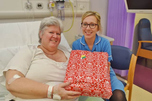 City Hospital campaign to get present for everyone in hospital over Christmas.
Carole Peel with staff nurse Rebekah Ambrose. EMN-161217-180813009
