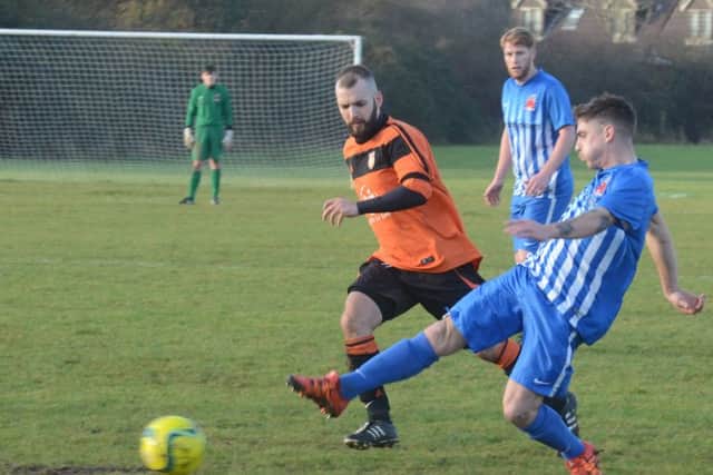 Action from Thorney (orange) against Pinchbeck at Campbell Drive. Photo: David Lowndes.