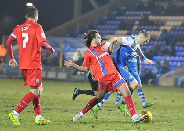 Marcus Maddison in action for Posh against Gillingham in 2015.