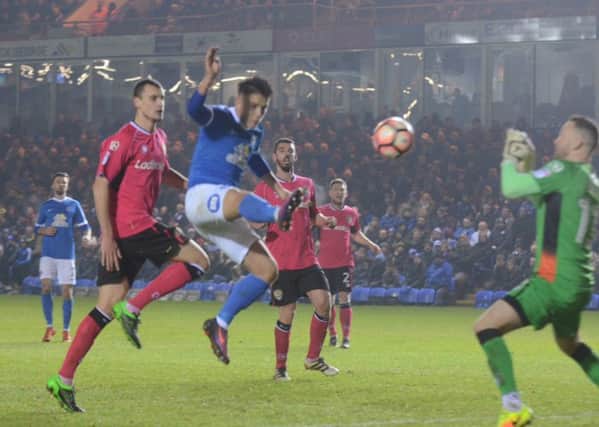 Posh striker Tom Nichols stretches to reach a cross in the 2-0 win over Notts County. Photo: David Lowndes.