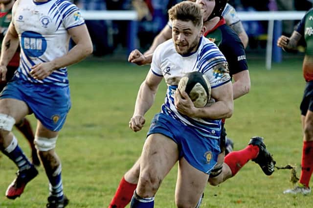 Will Carrington on his way to scoring a try for the Lions against Lichfield. Picture: Mick Sutterby
