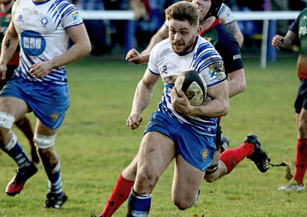 Will Carrington on his way to scoring a try for the Lions against Lichfield. Picture: Mick Sutterby