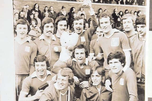 The successful Posh squad of 1973-74 celebrate winning Division Four. From the left are, back, Keith Bradley, Paul Walker, Eric Steele, John Cozens, Jeff Lee, Mick Jones, Jim Hall, Jack Carmichael, front, Bert Murray, John Barnwell, Tommy Robson, Dave Gregory and Freddie Hill.