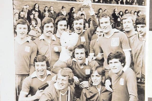 The successful Posh squad of 1973-74 celebrate winning Division Four.  From the left are, back, Keith Bradley, Paul Walker, Eric Steele, John Cozens, Jeff Lee, Mick Jones, Jim Hall, Jack Carmichael,  front, Bert Murray, John Barnwell, Tommy Robson, Dave Gregory and Freddie Hill.