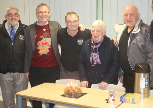 Celebrating with a Peterborough Referees Association birthday cake are, from the left, David Stapleton, Roger Ellison, chairman Robert Windle, Hazel Burgess and David Burgess.