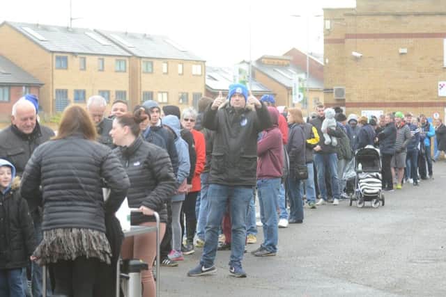Posh supporters queueing at the ABAX Stadium to buy tickets for the FA Cup game at Chelsea.