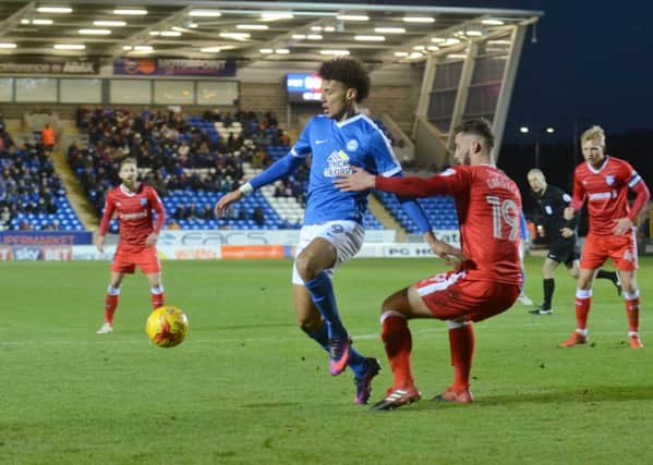 Posh striker Lee Angol can expect to start against Coventry.