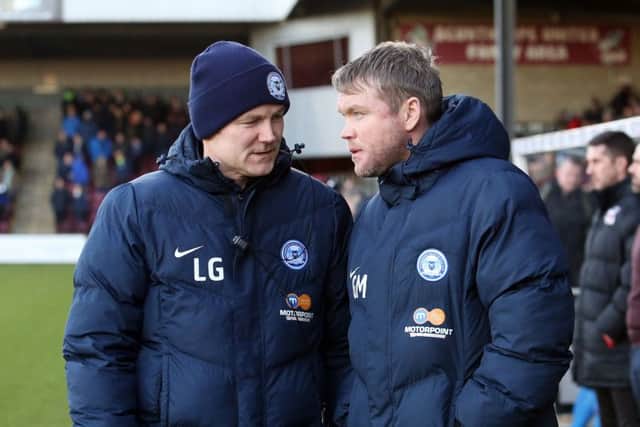 The Posh management team of Grant McCann (right) and Lee Glover before the game at Scunthorpe. Photo: Joe Dent/theposh.com.