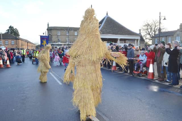 Whittlesey Straw Bear Festival in the town centre attended by morris dance groups EMN-160116-191737009