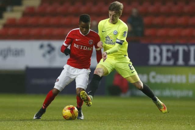 Posh skipper Chris Forrester (right) is a transfer target of Championship clubs.