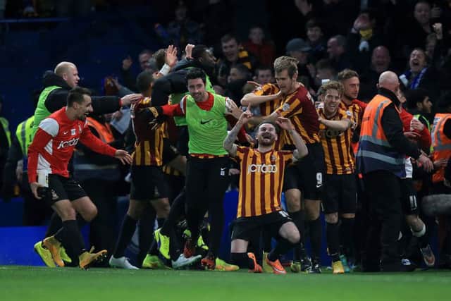 Bradford City players celebrate an FA Cup win at Chelsea in January, 2015.