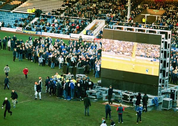 Posh fans trying to watch a big screen broadcast at the 2001 FA Cup tie at Stamford Bridge.
