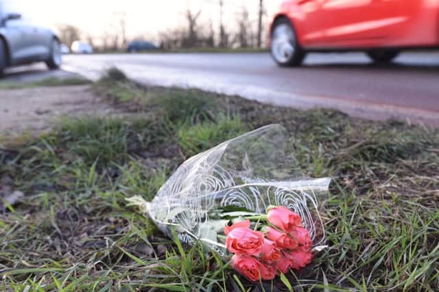 A single bunch of roses blowing in the wind at the side of the Farcet to Yaxley Road, scene of a double fatal RTC yesterday
