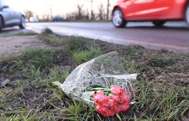 A single bunch of roses blowing in the wind at the side of the Farcet to Yaxley Road, scene of a double fatal RTC yesterday