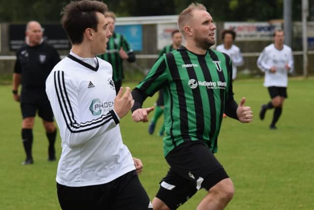 Liam Harrold (stripes) in action for Blackstones.