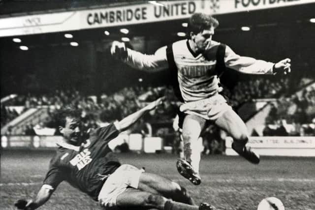 Former Posh skipper Mick Halsall in typically combative action.