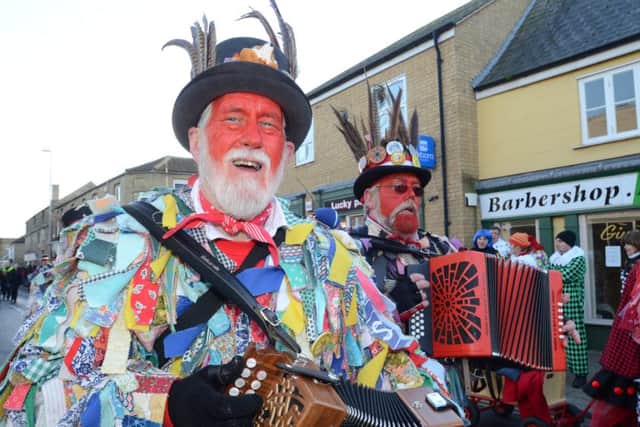 Whittlesey Straw Bear Festival in the town centre attended by morris dance groups EMN-160116-192111009