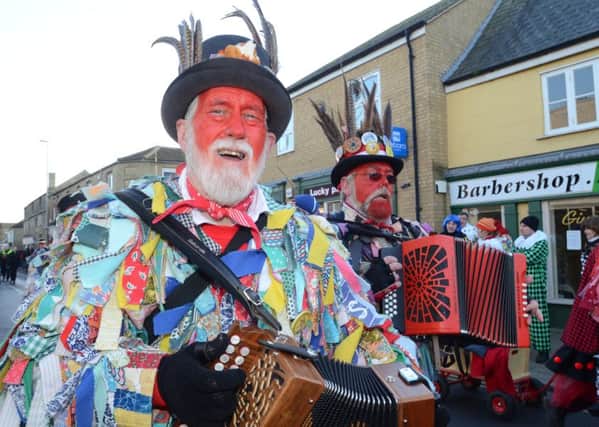 Whittlesey Straw Bear Festival in the town centre attended by morris dance groups EMN-160116-192111009
