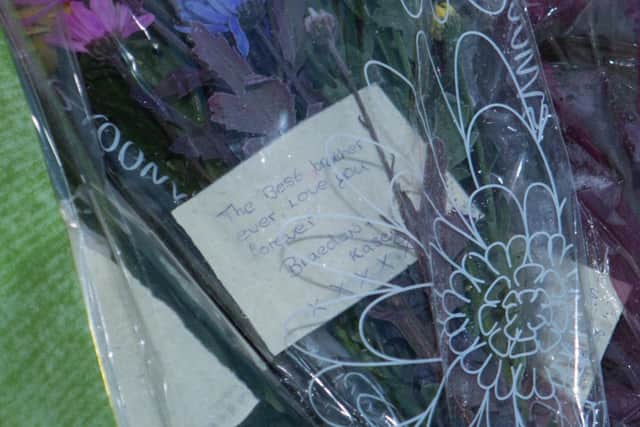 Tributes are left by the side of the road for the pair killed in a hit and run in Yaxley.,
Yaxley, Peterborough
05/01/2017.
Picture by Terry Harris. THA