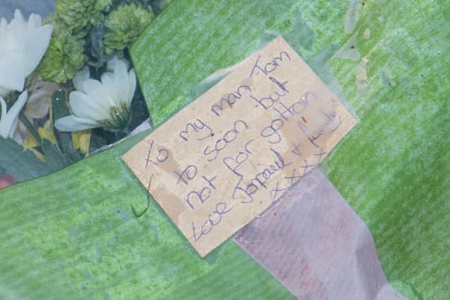 Tributes are left by the side of the road for the pair killed in a hit and run in Yaxley.,Yaxley, Peterborough05/01/2017. Picture by Terry Harris. THA