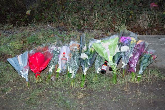Tributes are left by the side of the road for the pair killed in a hit and run in Yaxley.,Yaxley, Peterborough05/01/2017. Picture by Terry Harris. THA