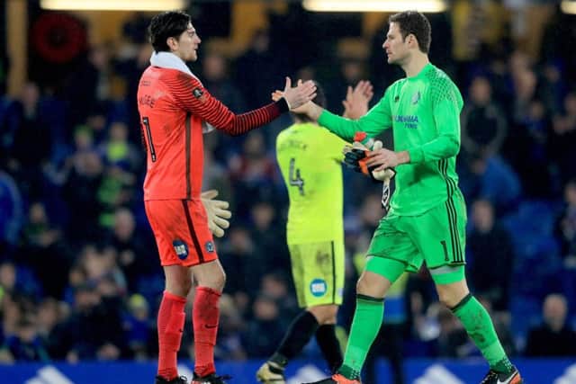Peterborough United goalkeeper Luke McGee (left) and Chelsea goalkeeper Asmir Begovic shake hands after the final whistle. Picture: Joe Dent