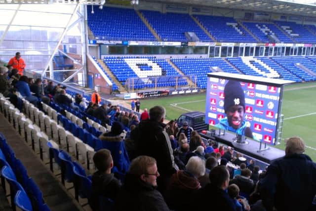 Posh fans watching pre-match build-up on the big screen