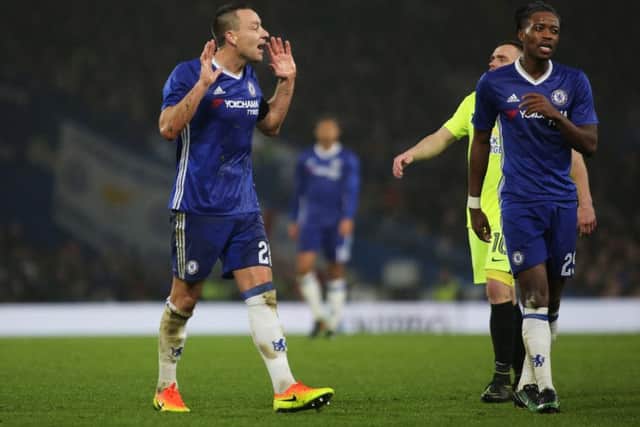Chelsea skipper John Terry pleads his innocence after being shown the red card by referee Kevin Friend. Photo: Joe Dent/theposh.com.