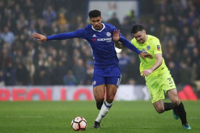 Andrew Hughes of Posh tangles with Chelsea's Ruben Loftus Cheek. Photo: Joe Dent/theposh.com.