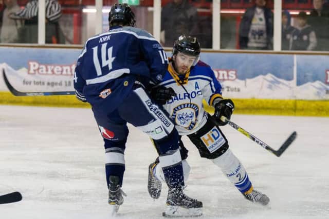 Phantoms defenceman Tom Norton checksSheffield's Liam Kirk. Photo: Tom Scott - AMOimages.com.