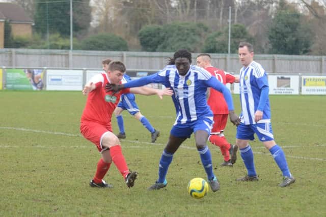 Ali Nyang (blue) of Peterborough Sports during the 2-1 Peterborough Premier Division win over Wisbech Town Reserves. Photo: David Lowndes.
