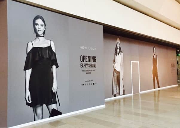 The hoardings hiding the transformation on the new New Look store in Queensgate.
