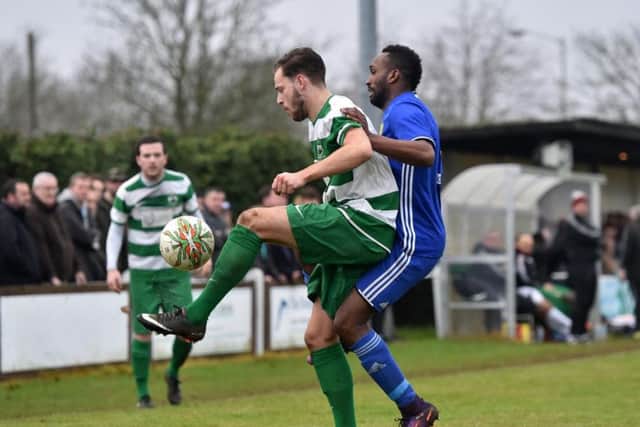Avelino Vieira (right) of Peterborough Sports scored twice against ON Chenecks.