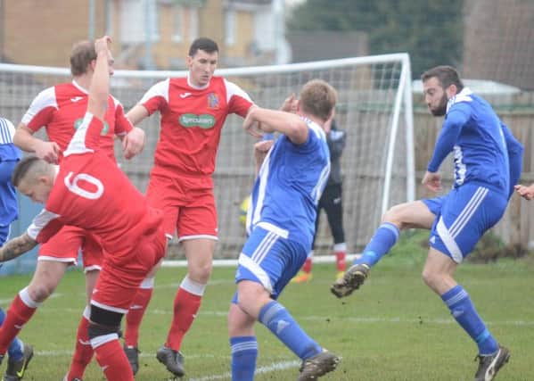 Action from Peterborough Sports Reserves' win over Wisbech Town Reserves (red) last weekend. Photo: David Lowndes.